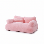 Pink fluffy plush pet sofa bed on white background